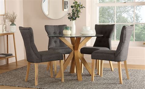 Hatton Round Oak and Glass Dining Table with 4 Bewley Slate Fabric Chairs | Furniture Choice