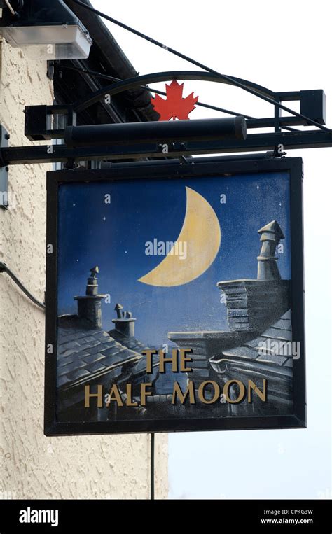 The Half Moon pub sign, Wolston, Warwickshire, UK Stock Photo - Alamy