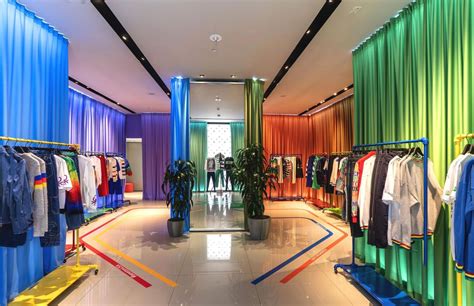 the inside of a clothing store with colorful curtains