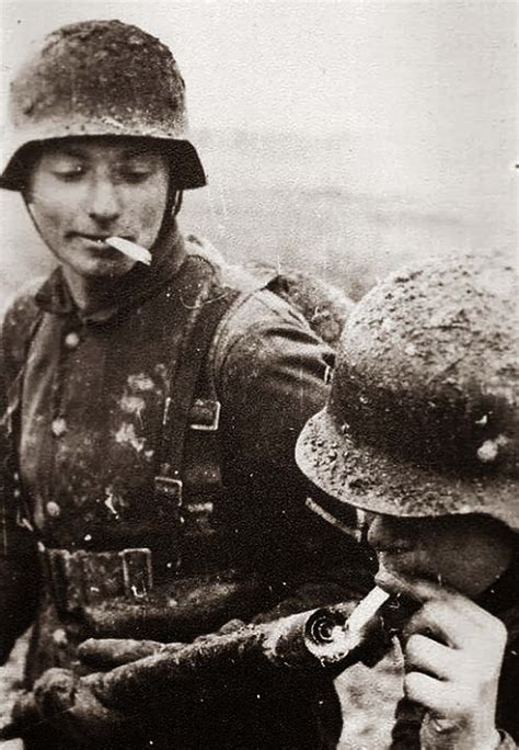 German soldier lighting his cigarette with a flamethrower, 1917 - Rare Historical Photos