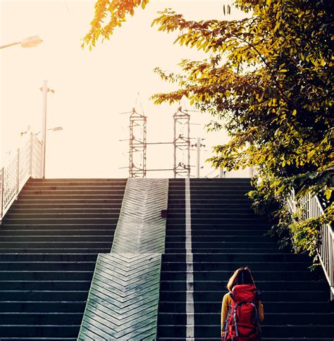 Girl with a backpack walking up the stairs | Free stock photo - 3146