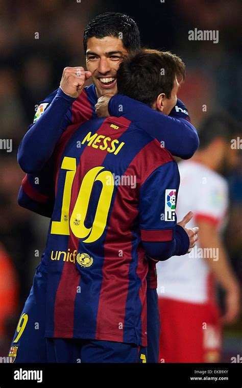 Luis Suarez (FC Barcelona) celebrates with his teammate Lionel Messi ...