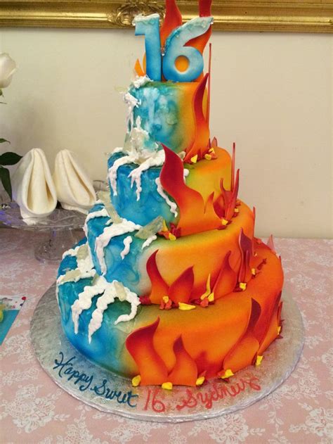 a multi - tiered cake decorated with colorful frosting and icing on a table