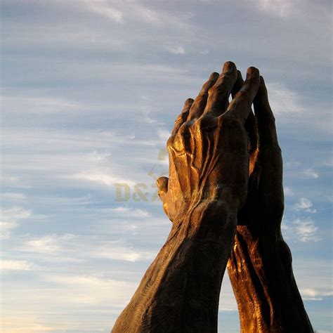 Giant praying hands statue