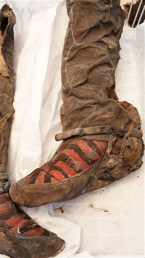 Secrets of Mongolian mummy buried in 'Adidas' shoes 1,100 years ago