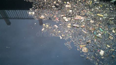 Water Pollution Effects Dirty Garbage in Canal. Stock Image - Image of float, blue: 118955887