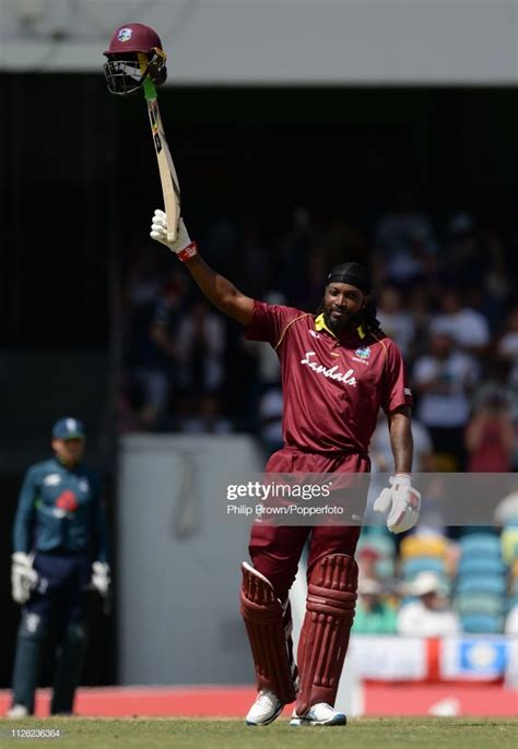 Chris Gayle of the West Indies celebrates reaching his century during... | West indies, Sports ...