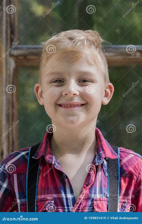 Beautiful Boy 7 Years Old Stands in the Park. Stock Image - Image of ...