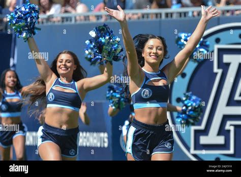 Toronto Argonauts cheerleaders run on the field before rhe game start ...