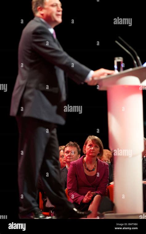 Yvette Cooper, looks on as husband Ed Balls addresses delgates ...