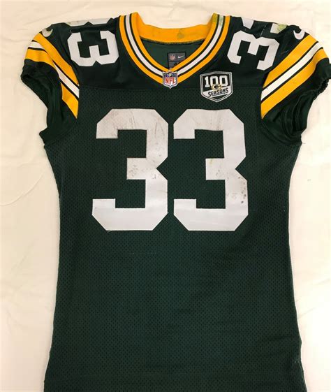 NFL Auction | STS - Packers Aaron Jones Game Worn Jersey (With Packers 100th season patch) 11/11/18