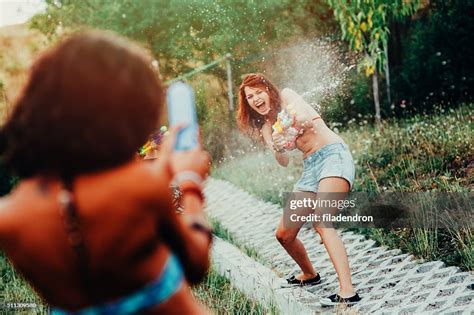 Water Gun Fight High-Res Stock Photo - Getty Images