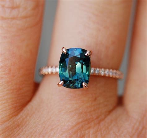 customized with Godivah setting -Peacock sapphire engagement ring. Teal ...