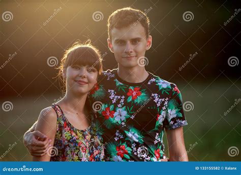 Happy couple at sunset stock photo. Image of romance - 133155582