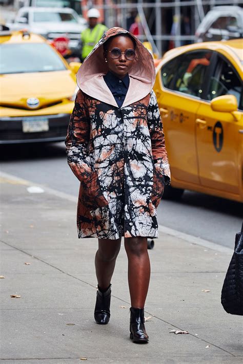 Lupita Nyong’o in the Winter Statement Coat | Vogue