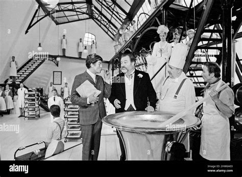 Dick Van Dyke (left) and James Robertson Justice (in black tails) filming a scene for Chitty ...