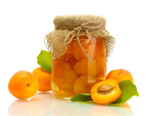 Premium Photo | Canned apricots in a jar and sweet apricots isolated on ...