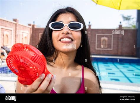 Indian girl enjoying fan air hi-res stock photography and images - Alamy