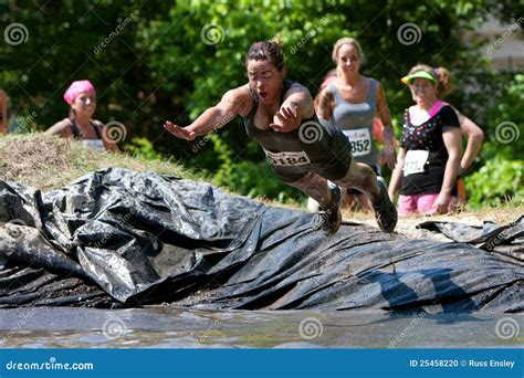 Woman Dives Into Mud Pit On Obstacle Course Editorial Image ...