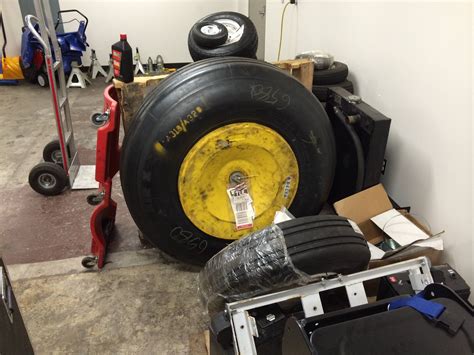 A319/A320 main gear wheel. MD88 nose wheel in front. Dolly for scale ...