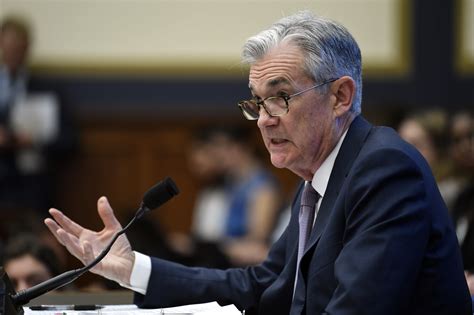 The Latest: Markets end up after Powell hints at rate cut