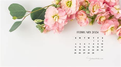 a calendar with pink flowers and green leaves