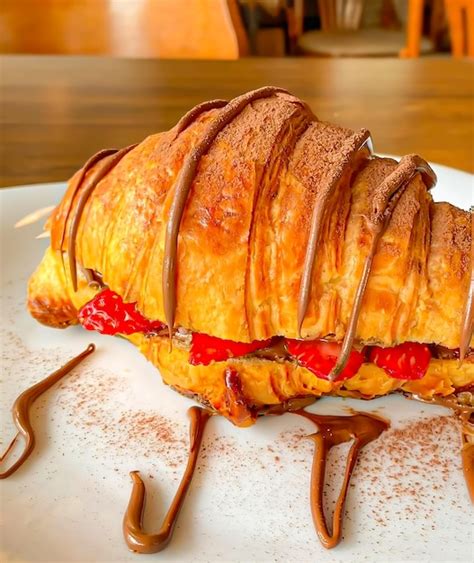 Premium Photo | Delicious croissant chocolate and strawberry isolated bakery
