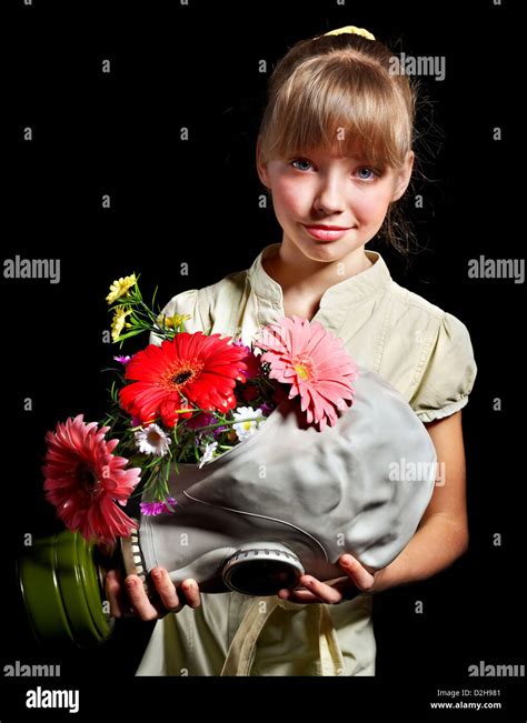 Child holding flowers and gas mask Stock Photo - Alamy