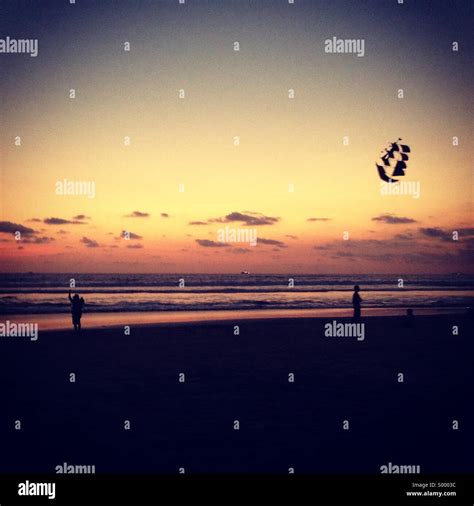 Sunset on Seminyak beach, Bali Stock Photo - Alamy