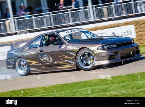 Nissan Skyline R33 drift car with driver Martin Richards at the 2016 Goodwood Festival of Speed ...