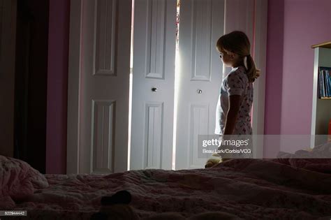 Girl Afraid Of The Dark High-Res Stock Photo - Getty Images