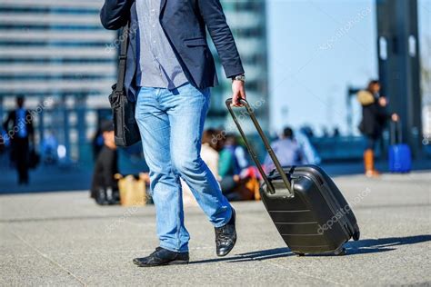 Worker man walking with suitcase in the street — Stock Photo © Pixinooo ...