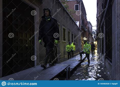 VENICE, ITALY - November 24, 2019: St. Marks Square Piazza San Marco during Flood Acqua Alta in ...