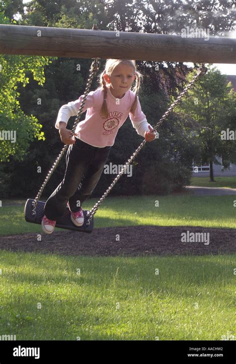 Girl on swing Stock Photo - Alamy