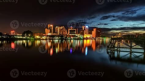 Kuching city at night with reflection. 1215926 Stock Photo at Vecteezy