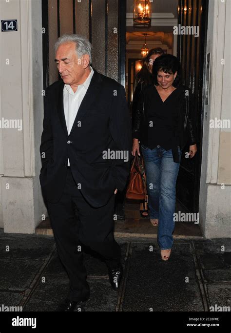 Dominique Strauss-Kahn and his wife Anne Sinclair leaving a building ...