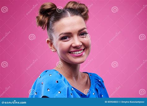 Side View of Trendy Girl with Two Buns Posing at the Camera Stock Image ...