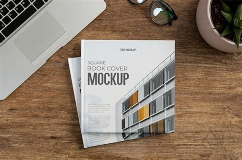 Premium PSD | Square book mock-up on wooden office desk