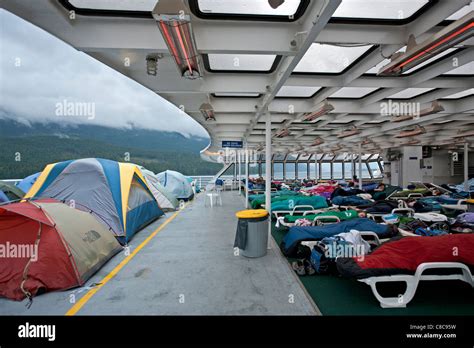 Passenger sleeping in the solarium. Columbia ferry. Alaska Inside Stock ...