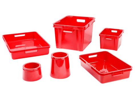 red plastic storage containers and cups on a white background