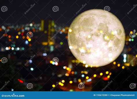 Super Super Full Harvest Moon on Night Sky and Reflection Light of City on Window Stock Photo ...