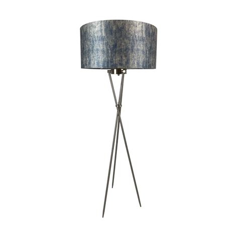 a floor lamp with a blue shade on the top and metal legs, against a white background