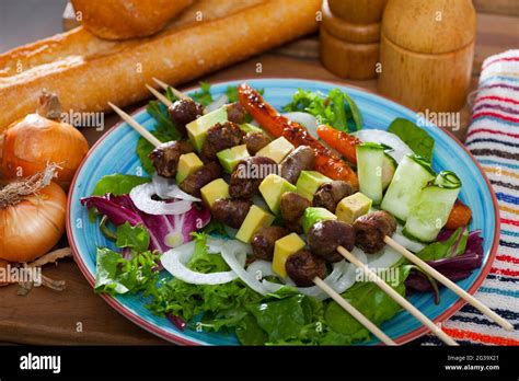 Chicken hearts skewers with avocado Stock Photo - Alamy