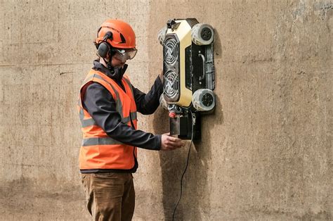 THIS AUTOMATED WALL-CLIMBING ROBOT WAS DESIGNED BY HAUSBOTS TO STREAMLINE HOME-CONSTRUCTION ...