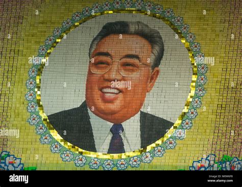 Kim il Sung portrait made by children pixels holding up colored boards ...