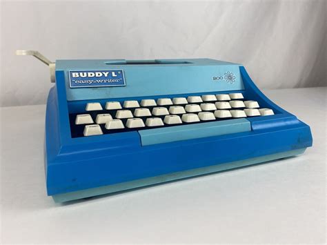 The blue typewriter with white keyboard - Just Melanie W.