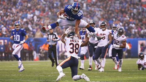 Saquon Barkley shows vertical as he hurdles a defender