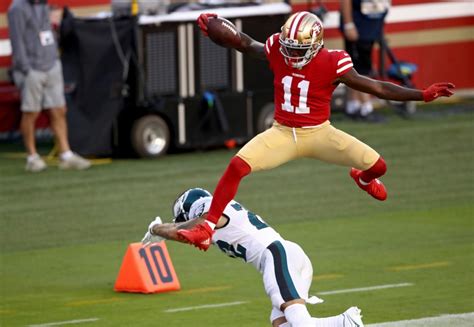 Video: 49ers' Brandon Aiyuk hurdles Eagles player for touchdown