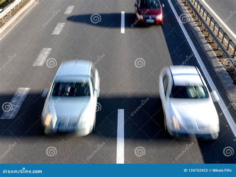 Highway speed lane driving stock image. Image of auto - 134752423