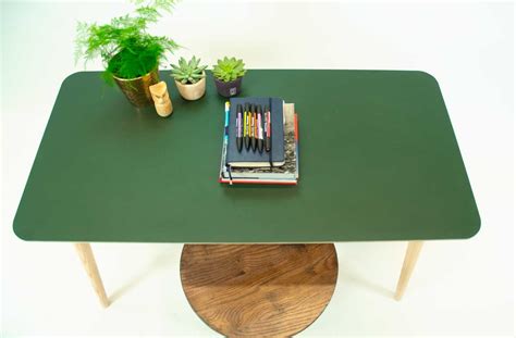 Modern linoleum tabletop or desktop table based on birch play-wood comes with solid wood tapered ...
